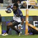 Brumbies' winger Henry Speight crosses for a try