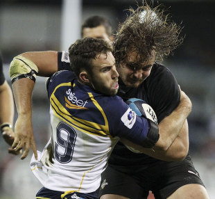 Brumbies' scrum-half Nic White tries to get to grips with the Southern Kings flanker Wimpie van der Walt. Brumbies v Southern Kings, Super Rugby, Canberra Stadium, Canberra, Australia, April 5, 2013