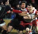 Biarritz's Marcello tackles Gloucester's Shane Monahan 