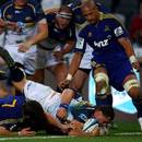 Brumbies flanker George Smith crosses over for a try