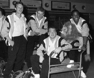 Lions tourists Paul Deans, Finlay Calder, Ieuan Evans and Chris Oti relax before departing for the 1989 Lions tour to Australia. Lions Tour, Heathrow Airport, London, England, June 3, 1989