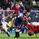 The Crusaders' Owen Franks tackles the Highlanders' Ma'a Nonu