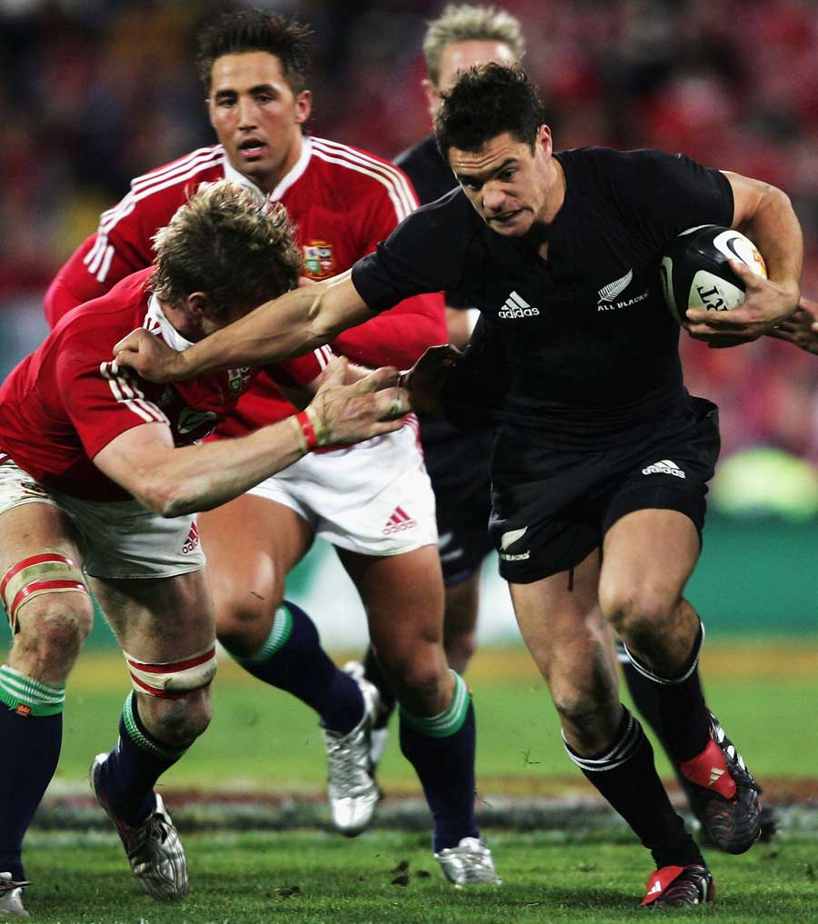 Dan Carter waltzes past Simon Easterby. New Zealand v British and Irish Lions, Second Test, Westpac Stadium, July 2 2005.