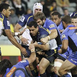 The Brumbies' George Smith is tackled by Force players, Brumbies v Western Force, Super Rugby, Canberra Stadium, Canberra, April 27, 2013