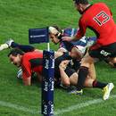 The Crusaders' Zac Guildford scores a try against the Rebels
