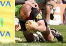 Harlequins' Rob Buchanan prepares to ground the ball against the post
