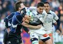 Castres Olympique's Yannick Forester (R) is tackled by Leinster's Brian O'Driscoll 