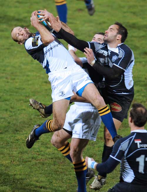 Leinster's fullback Chris Whitaker (L) vies with Castres' No.8 Florian Faure
