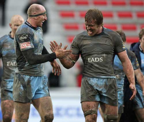 Cardiff Blues' Gareth Thomas and Andy Powell celebrate victory over Biarritz