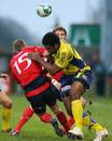 Clermont Auvergne's Napolioni Nalaga tackles Munster's Keith Earls 