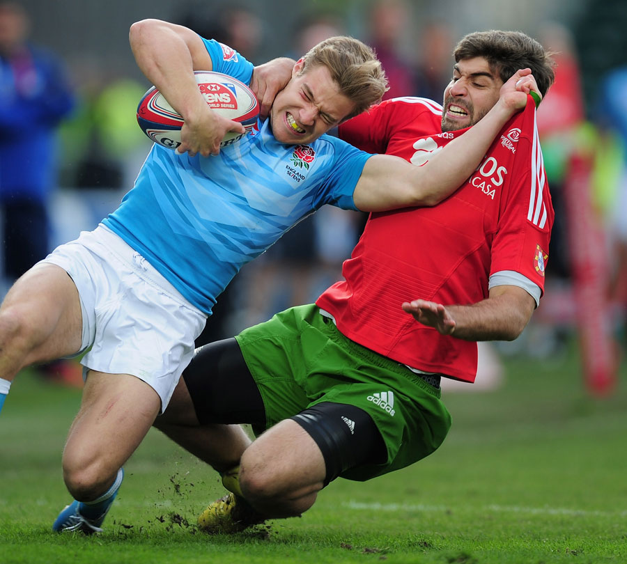 England's Tom Mitchell is tackled by Portugal's Luis Sousa 