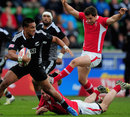 New Zealand's Lote Raikabula slips the tackle of Wales' Tom Graham 