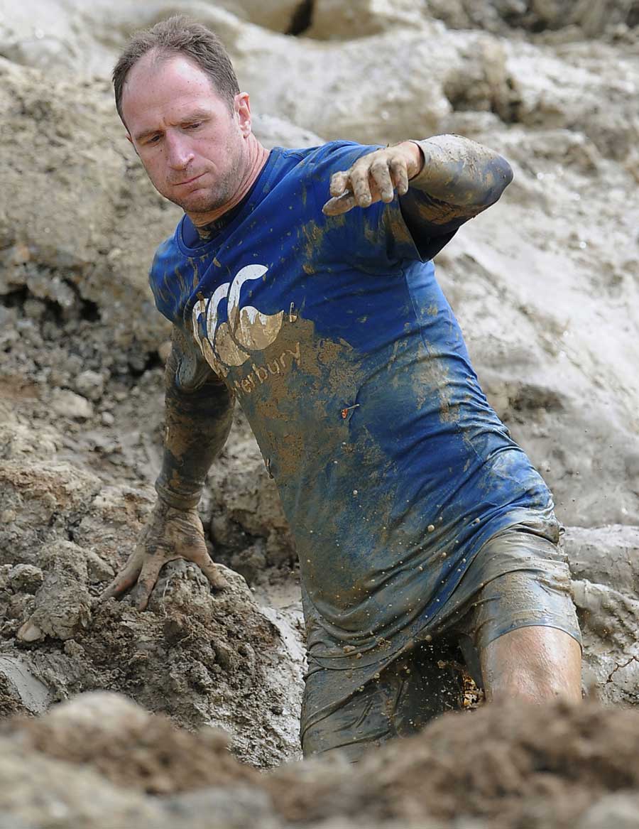 Mike Catt wades through the mud at Tough Mudder 2013 