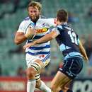 The Stormers' Andries Bekker charges the Waratahs' Rob Horne