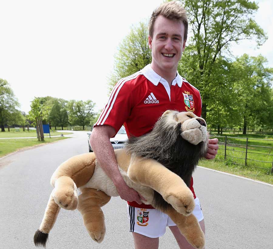 Stuart Hogg carries Bil - the British & Irish Lions' mascot