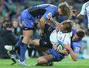 Charl McLeod of the Sharks is tackled against the Force