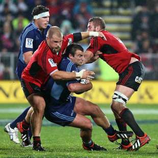 The Crusaders' Owen Franks and Luke Romano tackle the Blues' Tim Perry, Crusaders v Blues, Super Rugby, AMI Stadium, Christchurch, May 18, 2013