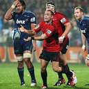 The Crusaders' Andy Ellis passes the ball in his 100th Super Rugby match