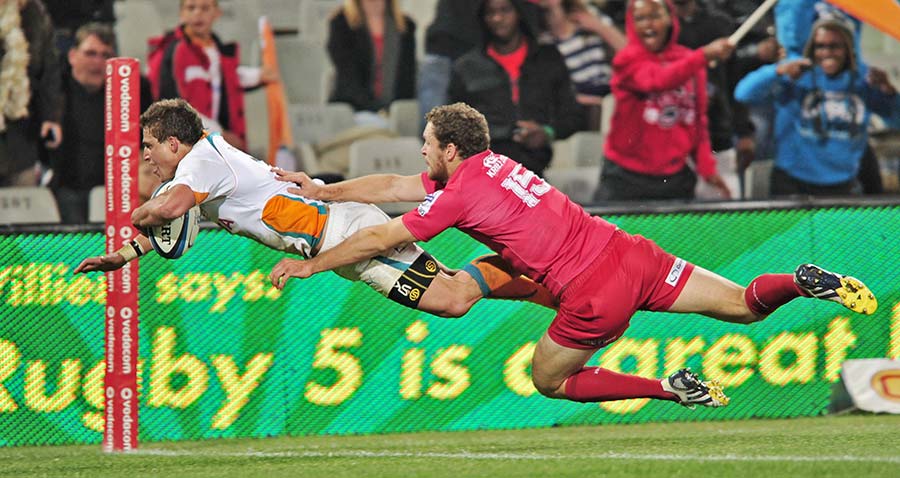 The Cheetahs' Piet van Zyl scores a try against the Reds