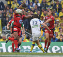 Toulon's Mathieu Bastareaud and Jonny Wilkinson charge down a drop goal