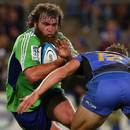 Liam Coltman of the Highlanders tries to fend off a tackle