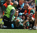 Leicester Tigers' Toby Flood recovers from a tackle by Northampton's Courtney Lawes