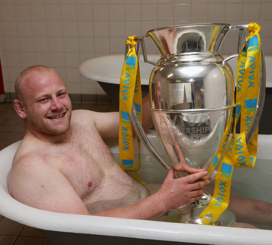 Leicester's Dan Cole relaxes with the Premiership trophy