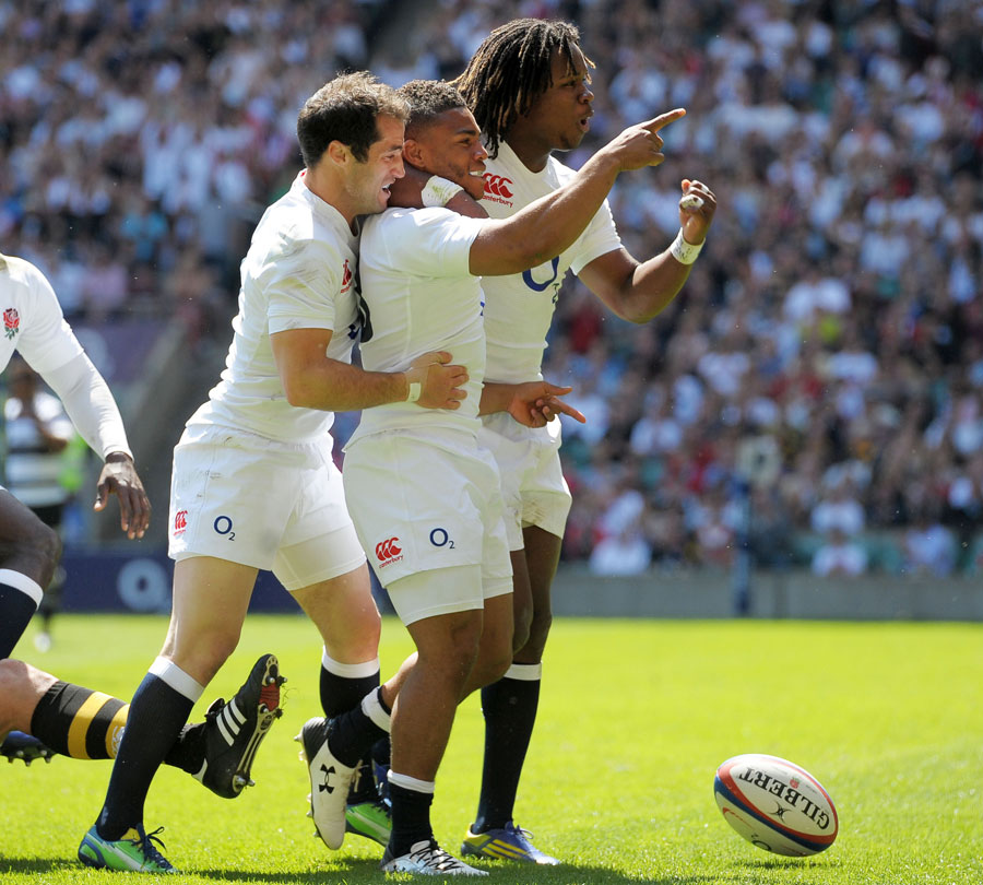England's Kyle Eastmond celebrates touching down