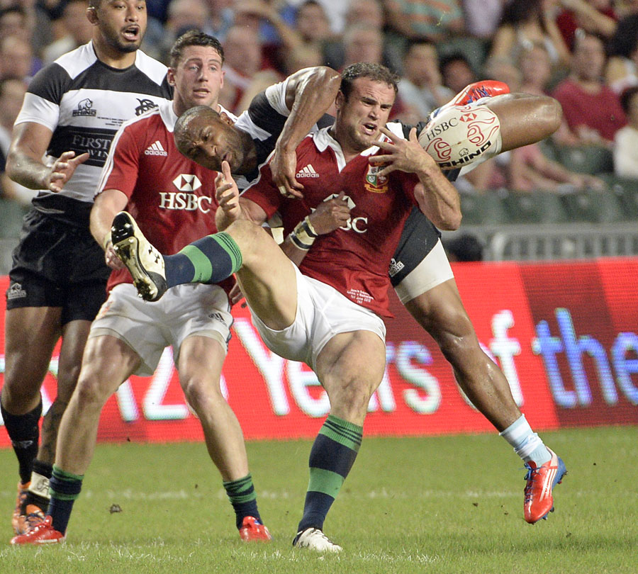 The Lions' Jamie Roberts looks to secure the ball