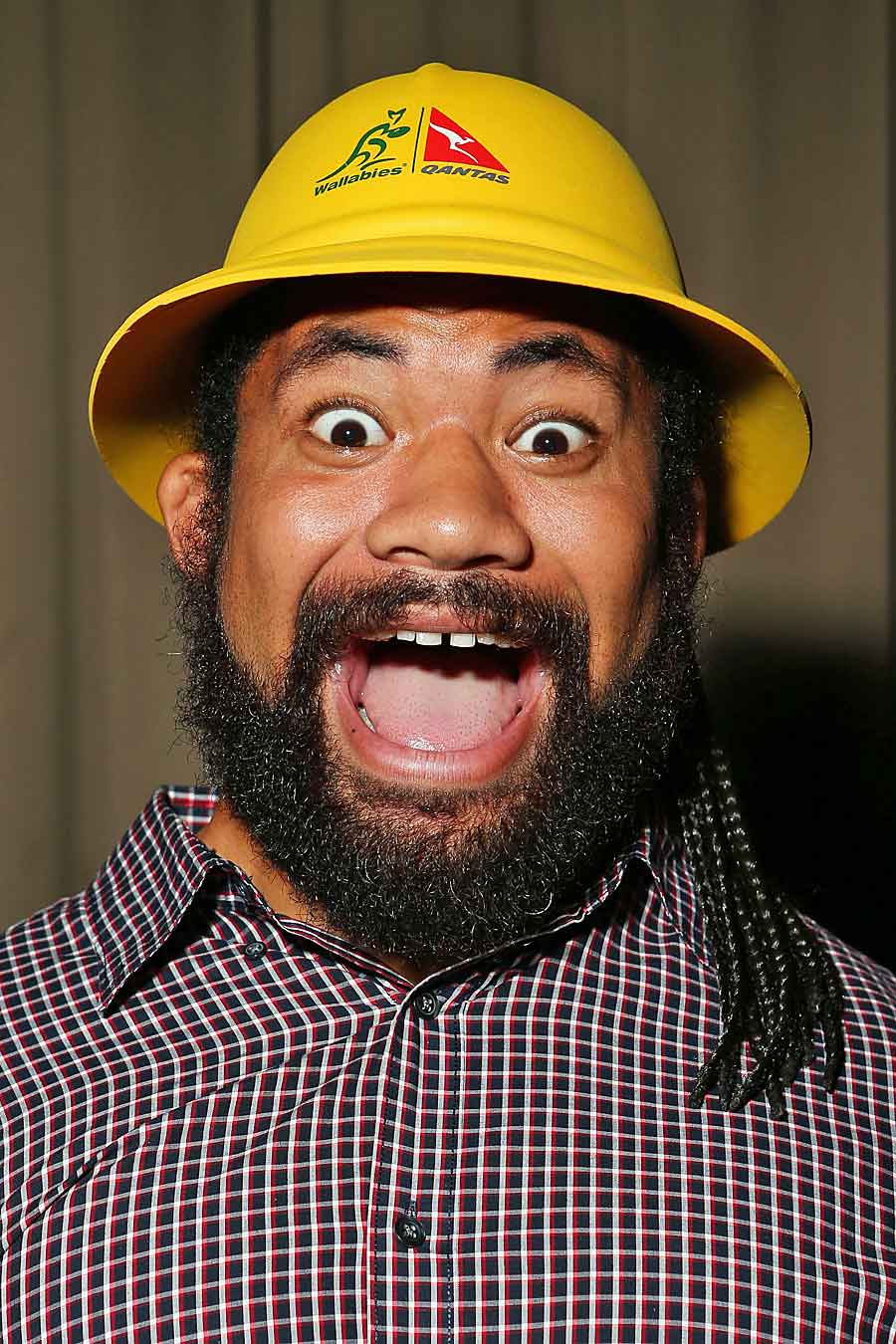 Tatafu Polota-Nau models one of the golden safari hats to be given away to Wallabies fans in order to combat the 'sea of red'