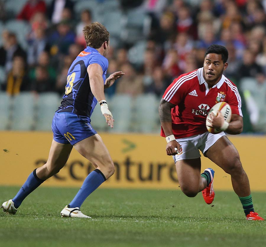 Manu Tuilagi makes an early charge for the Lions