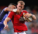 The Lions' Tom Croft is shackled by the Force defence