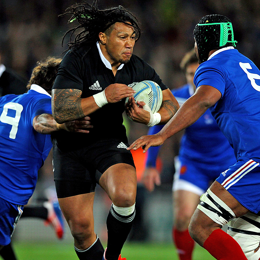 New Zealand's Ma'a Nonu breaks the tackle of France's Maxime Machenaud