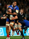 France's Sebastien Vahaamahina tackles New Zealand's Luke Romano