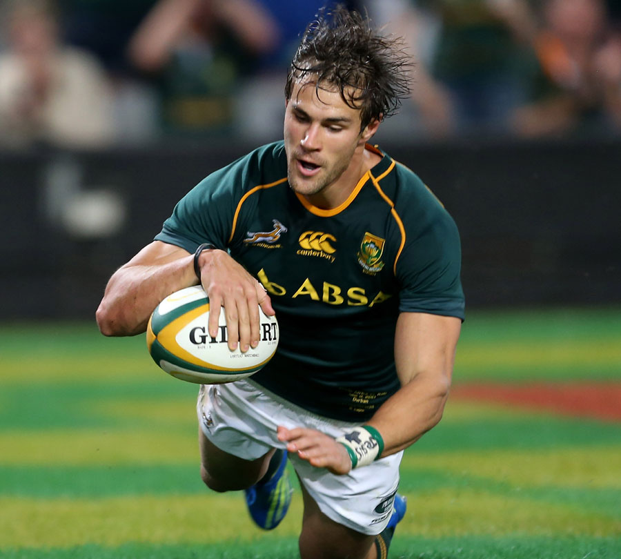 South Africa's JJ Engelbrecht  dives over to score