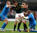 South Africa's Eben Etzebeth attracts the attention of the Italy defence