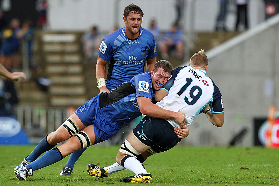 The Force's Angus Cottrell tackles the Waratahs' Liam Winton