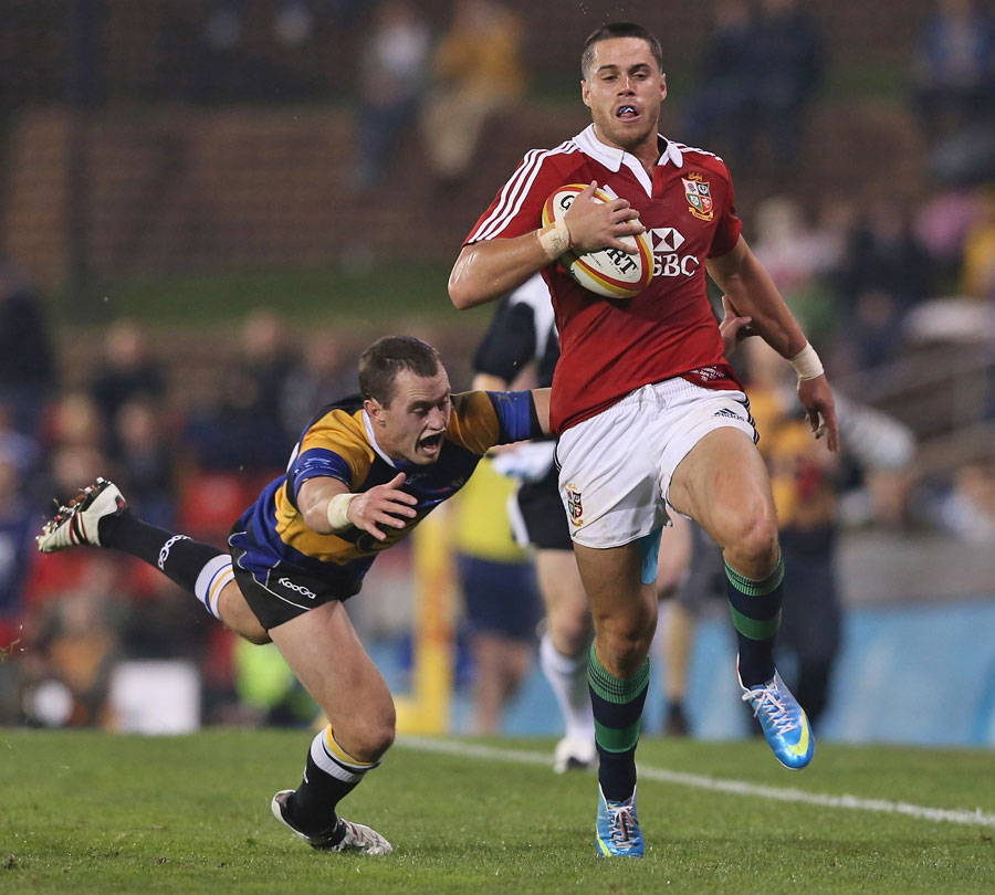 Lions fullback Sean Maitland races away from Combined Country's scrum-half Michael Snowden