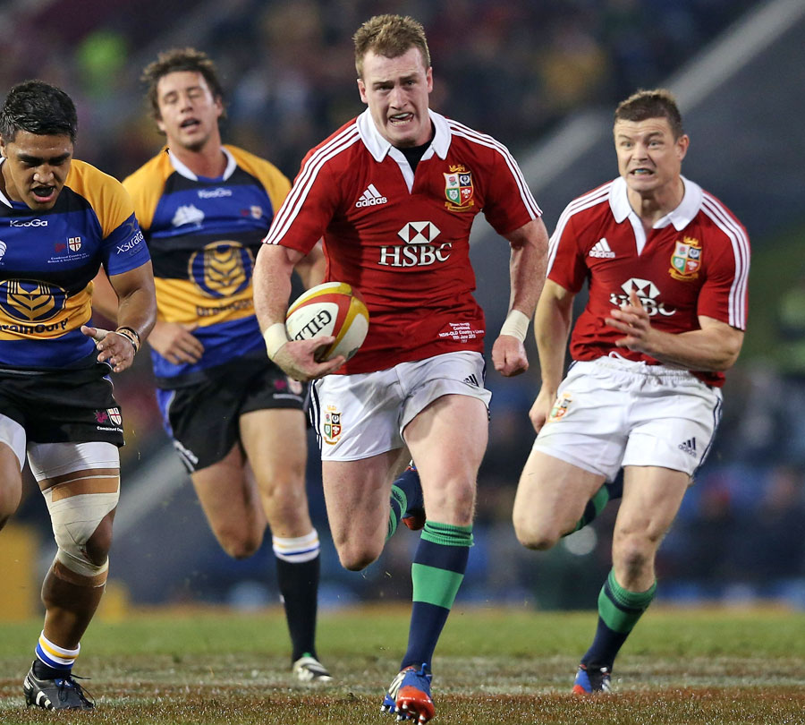 Lions fly-half Stuart Hogg carves his way through the Combined Country defence