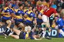The Lions' Justin Tipuric smashes through the Combined Country defence