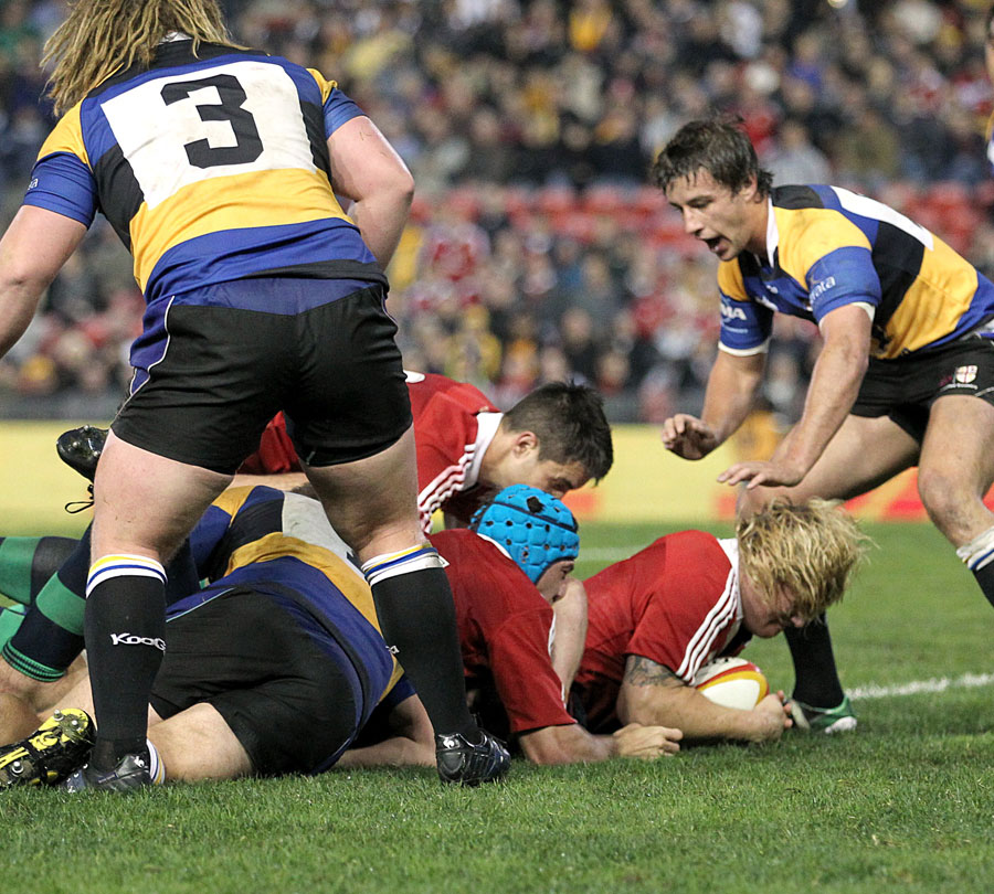 The Lions' Richard Hibbard burrows over for a try