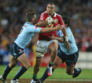 Lions winger Simon Zebo attracts the attention of the Waratahs' defence