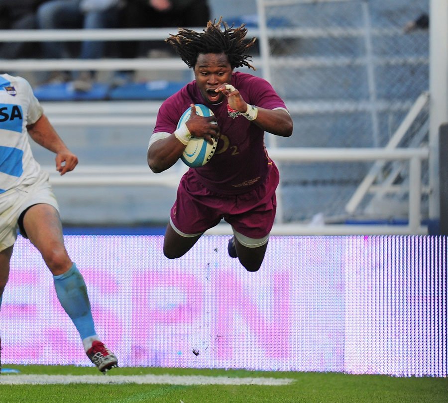 England's Marland Yarde dives in to score