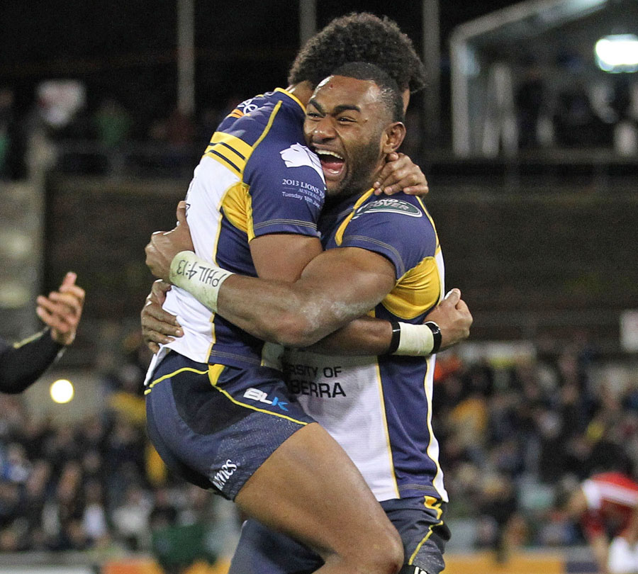 The Brumbies' Tevita Kuridrani and Henry Speight celebrate their victory over the Lions
