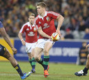The Lions' Owen Farrell looks to shift the ball