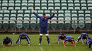 Out of step - Sebastien Vahaamahina warms up during a training session