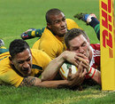 Australia's Israel Folau does just enough to deny the Lions' George North a score