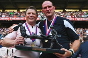 Scott Gibbs and Lawrence Dallaglio pose with the Help for Heroes Challenge Match trophy following the Help for Heroes XV's 29-10 victory over the International XV at Twickenham