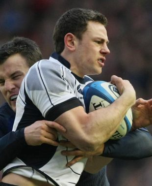 Nick De Luca of Scotland is stopped by Damien Traille of France during the RBS Six Nations Championship match between Scotland and France at Murrayfield on February 3, 2008 in Edinburgh, Scotland.