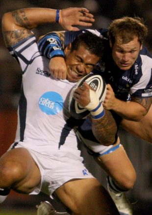 Bristol forward Alfie To'oala is tackled high by Lee Thomas of Sale during the Guinness Premiership match between Bristol Rugby and Sale Sharks at Memorial Stadium on September 19, 2008 in Bristol, England. 
